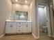 Modern bathroom featuring a double sink vanity and a toilet in a separate room at 9975 Sw 39Th Ter, Ocala, FL 34476