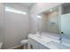Bathroom boasts double sinks, toilet, and a sleek, well-lit vanity, creating a serene atmosphere at 9975 Sw 39Th Ter, Ocala, FL 34476