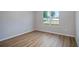 Empty bedroom with light wood flooring and a double-hung window at 9975 Sw 39Th Ter, Ocala, FL 34476