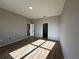 Bedroom featuring light-colored walls and wood-look flooring and ample sunlight at 9975 Sw 39Th Ter, Ocala, FL 34476