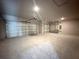 Spacious garage with two doors and overhead lighting for parking and storage at 9975 Sw 39Th Ter, Ocala, FL 34476