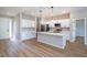 Open concept kitchen with island, quartz countertops, stainless appliances, and lots of cabinet space at 9975 Sw 39Th Ter, Ocala, FL 34476