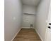 Empty laundry room with hookups and wood-look floors at 9975 Sw 39Th Ter, Ocala, FL 34476