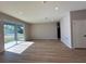 Empty living space with light wood flooring, sliding glass doors and recessed lighting at 9975 Sw 39Th Ter, Ocala, FL 34476