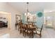 Dining room featuring a beautiful chandelier and easy access to other rooms at 1913 Augustine Dr, The Villages, FL 32159