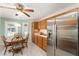 Sunny eat-in kitchen with a ceiling fan and a stainless steel refrigerator at 1913 Augustine Dr, The Villages, FL 32159