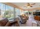 Relaxing sunroom with recliners and views of the backyard at 1913 Augustine Dr, The Villages, FL 32159