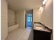 Bright bathroom featuring tile flooring, granite countertop vanity, and a shower-tub combination at 4365 Sw 90Th Pl, Ocala, FL 34476