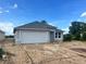 Charming single-story home with a large two car garage and neutral color scheme exterior at 4365 Sw 90Th Pl, Ocala, FL 34476