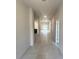 Bright hallway featuring a large entryway, neutral paint, and access to other rooms in the home at 4365 Sw 90Th Pl, Ocala, FL 34476