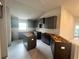 Kitchen featuring dark cabinets, a central island, and stainless steel appliances, ready for customization at 4365 Sw 90Th Pl, Ocala, FL 34476