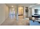 Spacious living room with tile flooring and a view of the entry way and kitchen at 4365 Sw 90Th Pl, Ocala, FL 34476
