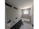 Modern bathroom featuring double sinks, and a separate shower and tub at 6150 Sw 123 Ave Rd, Dunnellon, FL 34432