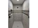 Custom tiled shower with modern fixtures and a sleek, clean design at 6150 Sw 123 Ave Rd, Dunnellon, FL 34432