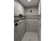 Custom tiled shower with modern fixtures and a sleek, clean design at 6150 Sw 123 Ave Rd, Dunnellon, FL 34432