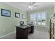 Well-lit office space with a large window and plantation shutters at 6877 Minchew Cir, The Villages, FL 34762