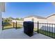 Outdoor patio featuring a grill with backyard views at 6877 Minchew Cir, The Villages, FL 34762