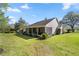 Expansive screened-in porch ideal for outdoor enjoyment with mature trees and verdant lawn at 760 Sw 89Th Ter, Ocala, FL 34481