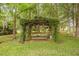 Beautiful backyard area with a vine-covered pergola and picnic table at 760 Sw 89Th Ter, Ocala, FL 34481
