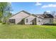 Spacious backyard showcasing a screened-in porch, offering a relaxing outdoor living space at 760 Sw 89Th Ter, Ocala, FL 34481