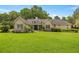 Inviting home with a well-maintained lawn and landscaping, showcasing its charming curb appeal at 760 Sw 89Th Ter, Ocala, FL 34481