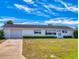 Charming single-story home with attached garage and well-maintained front yard at 11197 Sw 79Th Ave, Ocala, FL 34476