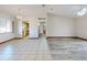 Open-concept living room features tile and wood-look flooring and a seamless transition to the kitchen at 11197 Sw 79Th Ave, Ocala, FL 34476