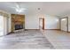 Spacious living room with tile and laminate flooring, a stone fireplace, and ample natural light through large sliding doors at 11197 Sw 79Th Ave, Ocala, FL 34476