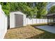 Backyard shed for storage with fence and access to the screened-in lanai at 2607 Verde Ln, Winter Park, FL 32792