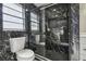 Modern bathroom featuring a glass-enclosed shower with elegant black marble tiling and dual shower heads at 2607 Verde Ln, Winter Park, FL 32792