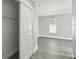 Bedroom featuring a sliding closet and a bright window, creating a clean and functional space at 2607 Verde Ln, Winter Park, FL 32792