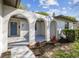 Welcoming front entrance featuring arched openings, providing a unique architectural charm and curb appeal at 2607 Verde Ln, Winter Park, FL 32792