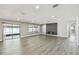 Spacious living room featuring a modern fireplace, large windows, and contemporary flooring at 2607 Verde Ln, Winter Park, FL 32792