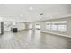 Spacious living area features modern lighting, with sliding doors to the outside, and an island kitchen at 2607 Verde Ln, Winter Park, FL 32792