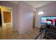 Entryway with tiled floors leading to a hallway and front door at 911 Oak Dr, Leesburg, FL 34748