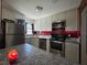 Bright kitchen featuring white cabinetry, modern appliances, and a functional layout, perfect for culinary enthusiasts at 911 Oak Dr, Leesburg, FL 34748