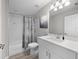 Bright bathroom featuring a tub-shower combo, white vanity, and neutral color palette at 44 Cedar Tree Dr, Ocala, FL 34472