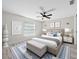 Bedroom with ceiling fan, bed, decor, and hardwood floors at 44 Cedar Tree Dr, Ocala, FL 34472