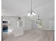 Living room with kitchen, dining area, hard wood floors and recessed lighting at 44 Cedar Tree Dr, Ocala, FL 34472