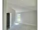 Neutral-toned bedroom with vaulted ceiling and natural light at 4498 Sw 90Th Lane Rd, Ocala, FL 34476