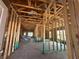 Interior view of wood framing, exposed ceiling beams, and concrete flooring at 4516 Sw 90Th Lane Rd, Ocala, FL 34476