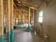 Partially insulated interior with visible wall framing and utility connections at 4516 Sw 90Th Lane Rd, Ocala, FL 34476