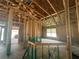 Unfinished interior framing featuring exposed ceiling and adjacent rooms at 4516 Sw 90Th Lane Rd, Ocala, FL 34476