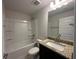 Bathroom features granite countertops, bathtub, and neutral color palette at 4528 Sw 90Th Lane Rd, Ocala, FL 34476