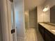 Bathroom with glass shower, dual sinks and granite counters at 4528 Sw 90Th Lane Rd, Ocala, FL 34476