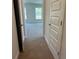 View from hallway into bedroom featuring two windows, neutral walls and carpet flooring at 4528 Sw 90Th Lane Rd, Ocala, FL 34476