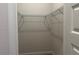 Walk-in closet with metal shelving and carpet flooring at 4528 Sw 90Th Lane Rd, Ocala, FL 34476