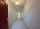 Home foyer showcasing a tile floor, door, light fixture, and spacious layout at 4528 Sw 90Th Lane Rd, Ocala, FL 34476