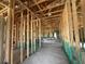 The interior framing of a new construction home reveals the layout and structural design at 4528 Sw 90Th Lane Rd, Ocala, FL 34476