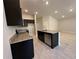 Kitchen island features a sink and stainless-steel dishwasher at 4528 Sw 90Th Lane Rd, Ocala, FL 34476